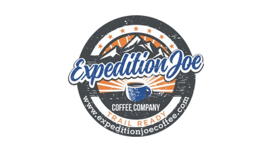 Blue lettering with orange, white, and dark gray, circular background, and blue cup of coffee.