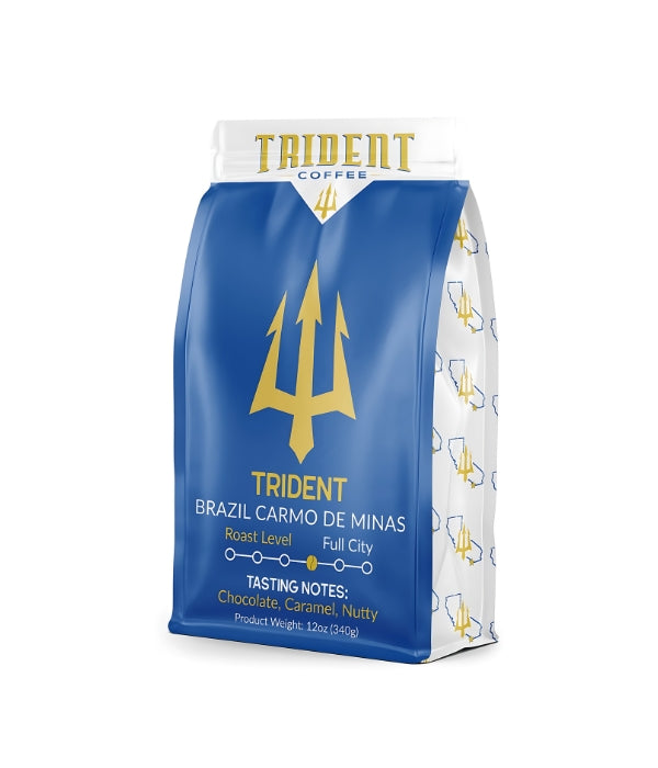 A bag of Trident coffee beans in front of a white background.