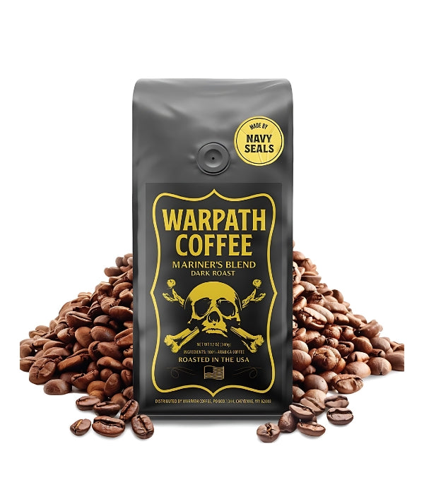 A bag of Warpath Coffee's Mariner's Blend Dark Roast Coffee in front of a mountain of coffee beans.